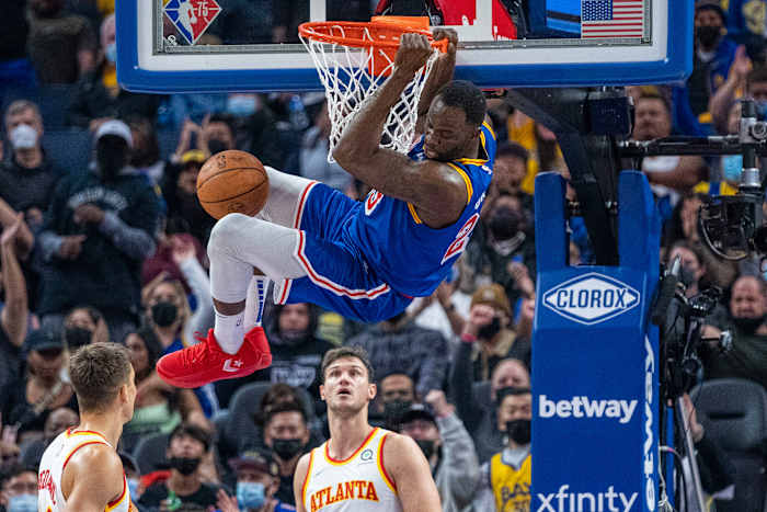 November 8, 2021; San Francisco, California, USA; Golden State Warriors forward Draymond Green (23) dunks the basketball against Atlanta Hawks guard Bogdan Bogdanovic (13) and forward Danilo Gallinari (8) during the second quarter at Chase Center.